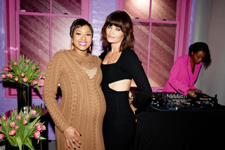 Alicia Quarles wearing the Tulip cable-knit dress in camel and Helena Christensen wearing the Square neck pencil dress in noir